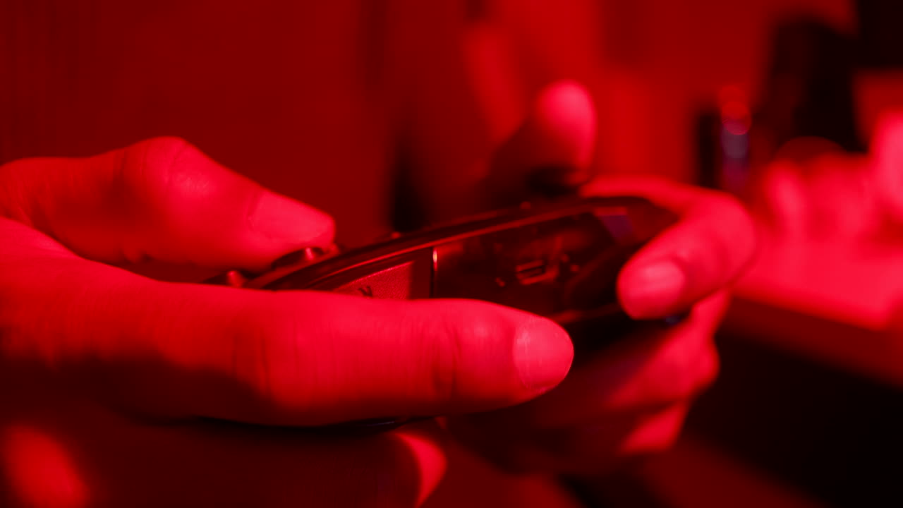 Gamer plays video games at night