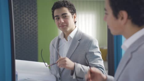 Funny-young-man-dreaming-of-becoming-a-businessman.