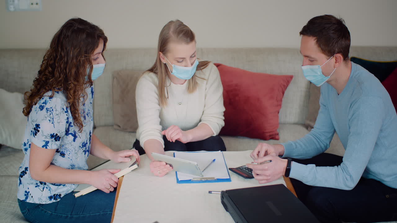 Group of people wearing facial masks in consultation