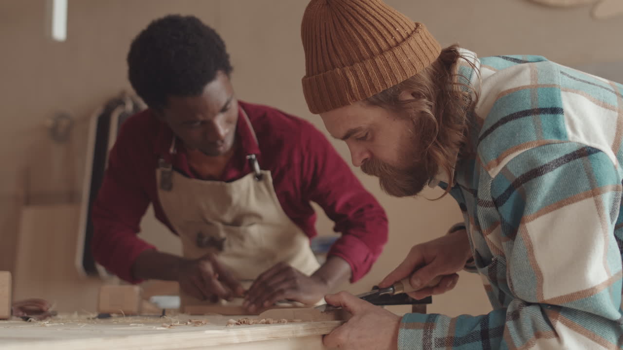 Two Diverse Joiners Working with Wood