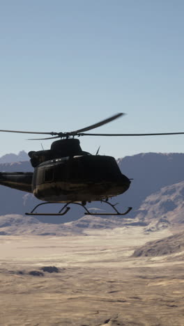 helicopter flying over a desert landscape