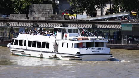 passenger boat sailing on river thames, london