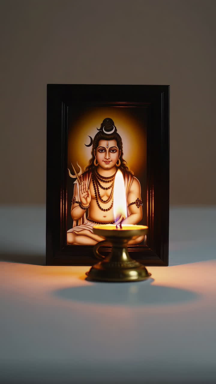Image of Lord Shiva with a lit Diya