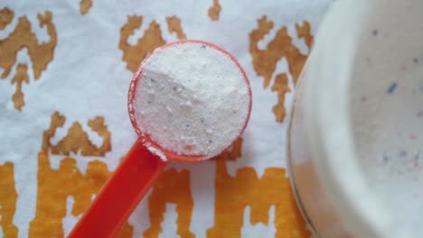 laundry detergent in a measuring scoop