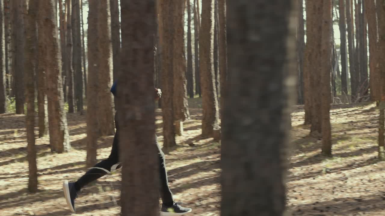 Man Running in a Forest