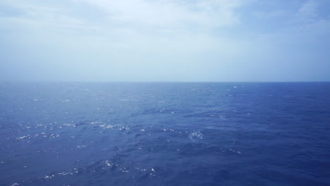 Lateral-view-of-the-sea-from-a-ferry-moving-away-from-La-Palma-Island,-Canary,-Spain