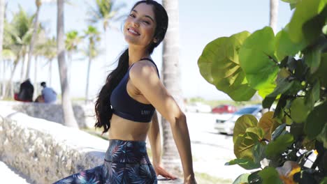 beautiful sporty woman posing at camera in park