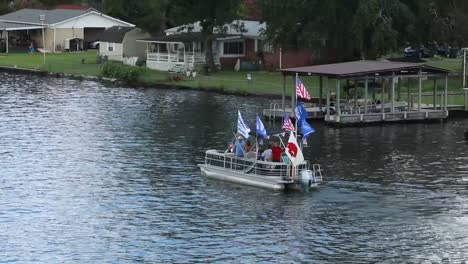 boats decorated to support usa trump pence 2020. hundreds of boats came out for the trump 2020 boat parade on lake hamilton in hot springs.