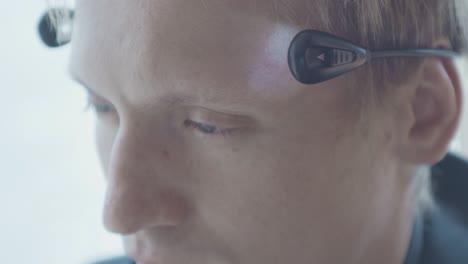 person adjusting a brain computer interface