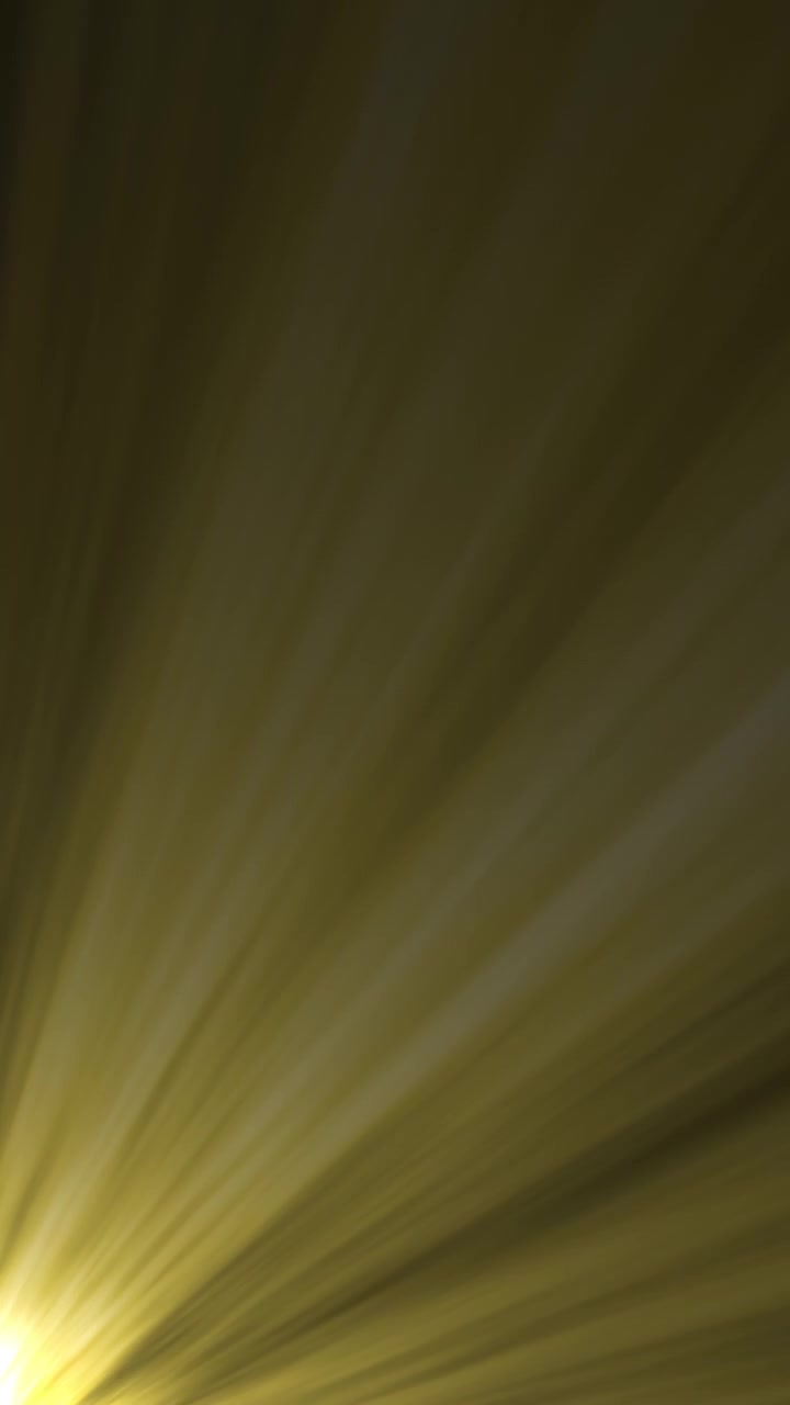 Golden Light Rays Shining and Radiating on Dark Background