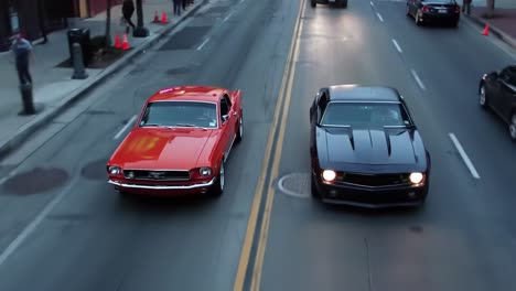 two classic muscle cars, one orange and one black, speed down busy downtown streets as pedestrians watch during a lively evening cruise event. excitement fills the air as engines roar.