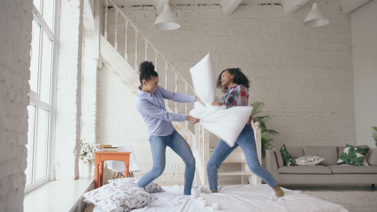 Sisters Having a Pillow Fight