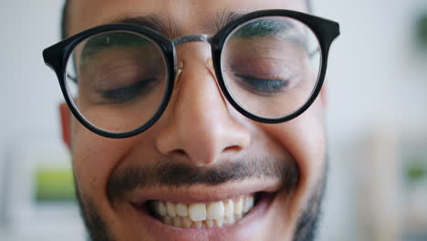 man smiling with glasses