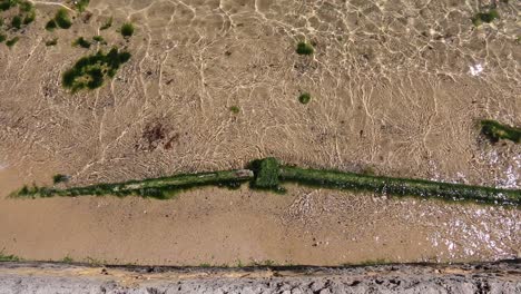 Gentle-waves-and-clear-water-lapping-over-the-old-Swan-River-sea-wall