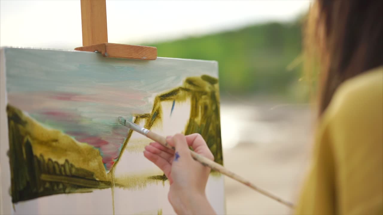 Artist Painting a Landscape on the Beach
