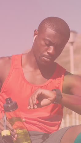 animation of shapes over african american man drinking water outdoors