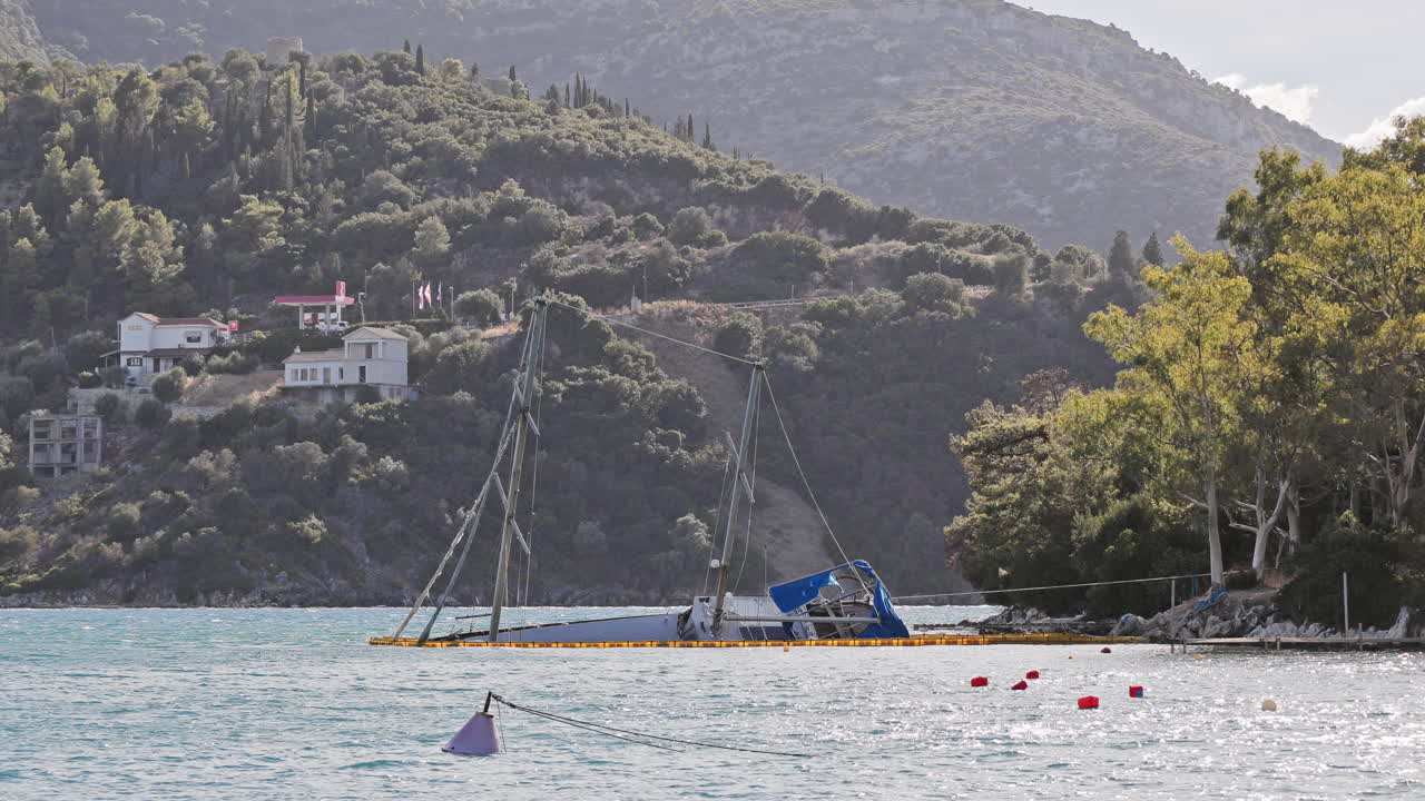 sunken yacht on the rocky coast in ithaca, greece