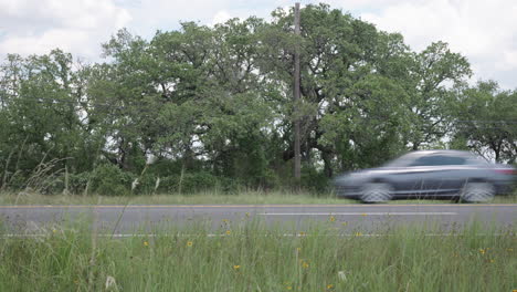 suvs and trucks drive along highway 281 in the texas hill country, near johnson city, texas - slider left to right
