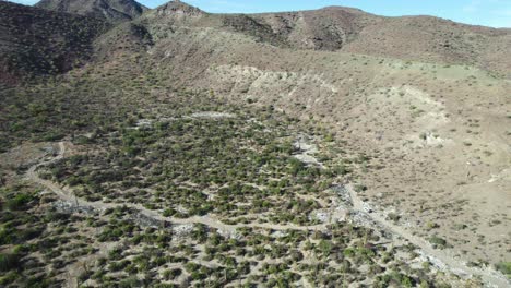 Trash-on-the-Roadside-Ruins-the-Desert-Beauty-of-Mulege-in-Baja-California-Sur,-Mexico---Aerial-Drone-Shot