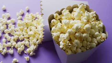 Video-of-close-up-of-popcorn-on-blue-background