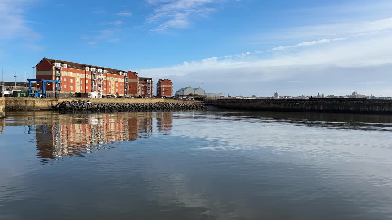 Aerial drone video of Hartlepool North East England UK coastal town with marina, harbour, and seaside urban landscape