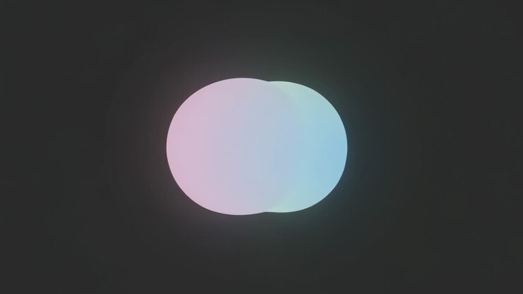 Appearing, two glowing discs sliding inward merging on dark backdrop into single disc with halos