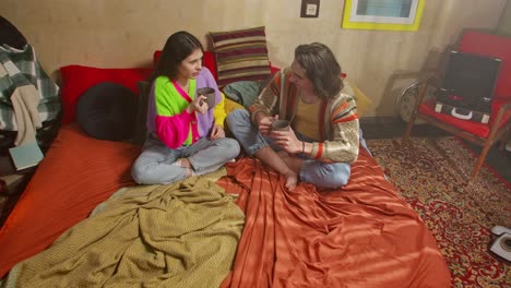 couple enjoying cozy morning in retro bedroom