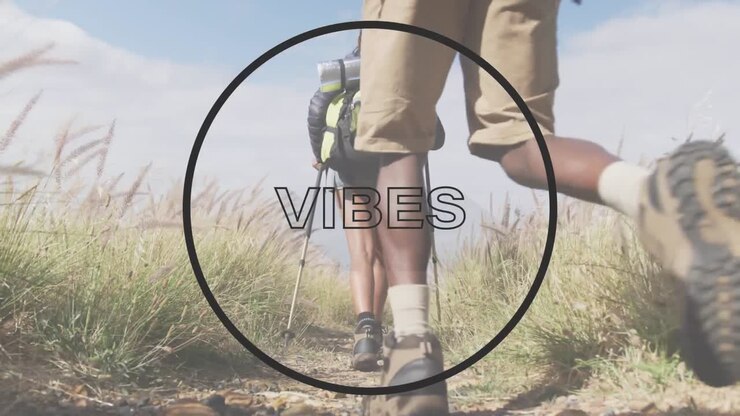 Animation of the word vibes and circle in black over legs of couple hiking in countryside