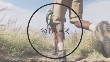 Animation-of-the-word-vibes-and-circle-in-black-over-legs-of-couple-hiking-in-countryside