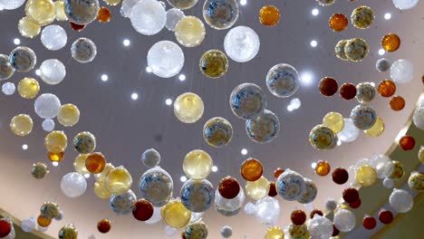 a ceiling decorated by colorful glass balls in a large hotel in el alamein, egypt low angle shot