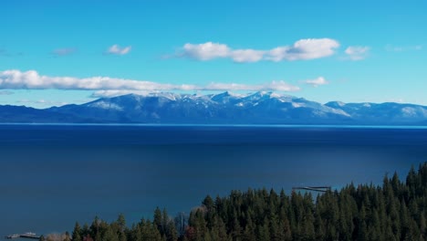 Stationary-drone-shot-overlooking-Lake-Tahoe-on-a-sunny-day