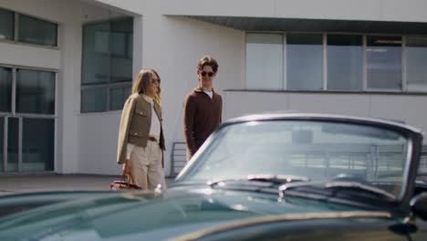 couple near a vintage car