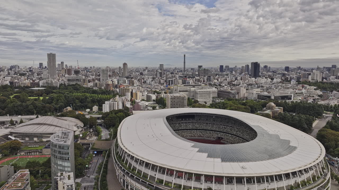 Panoramic view of a modern stadium and city skyline