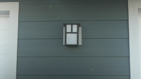 side of a garage with a light