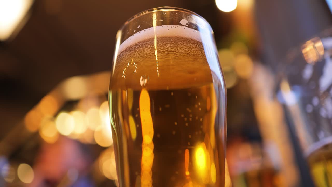 Glass of light beer on a pub.