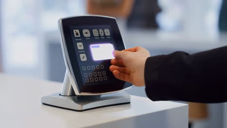 person using a key card with a digital access control system