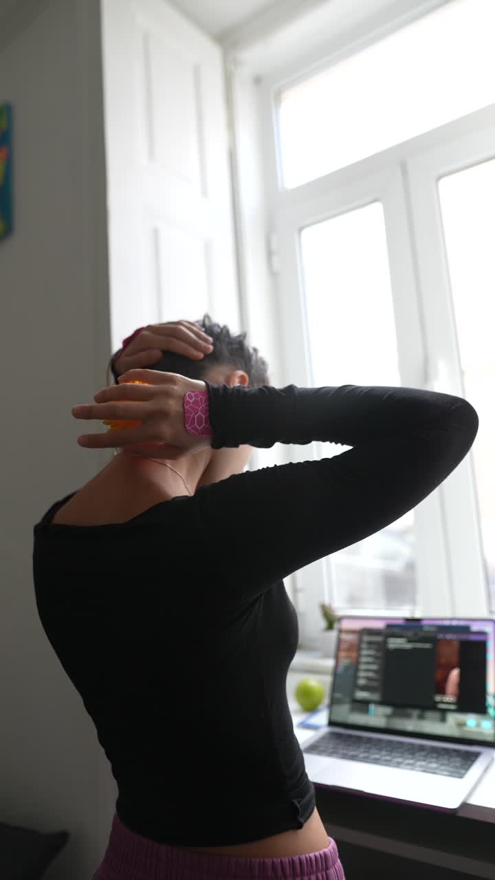 Woman massaging her neck