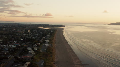 Aerial-drone-shot-of-sunset-on-Waikanea-beach