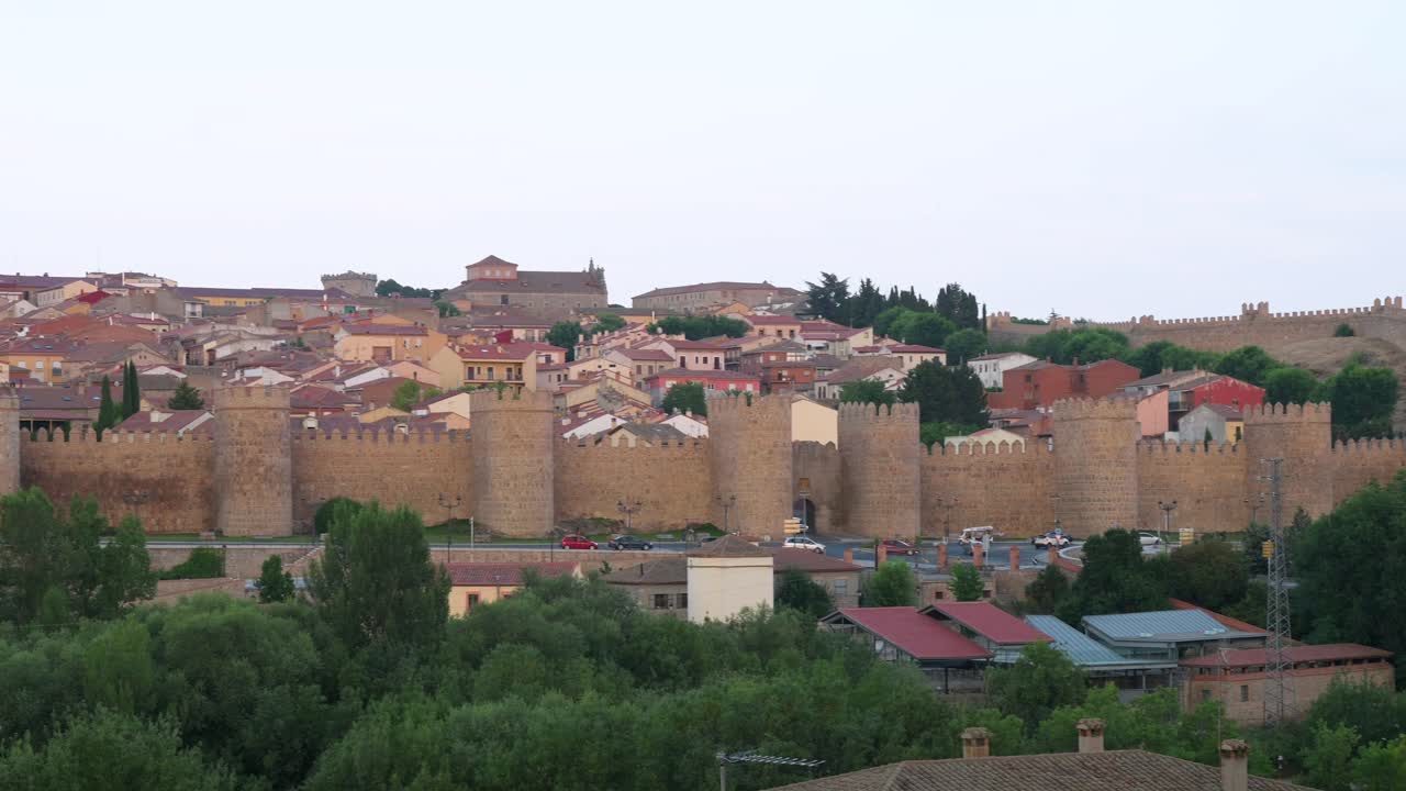 Panning shot view of Avila’s historic old town and its celebrated medieval walls, a UNESCO World Heritage Site in Spain.