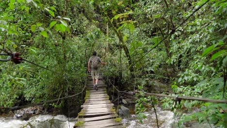 man traveler walking on footpath above river