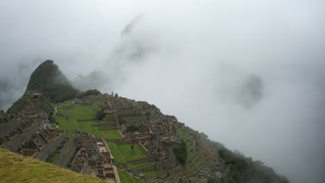 saturated cloudy green tourism: time lapse at machu picchu, peru