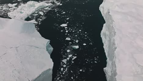 drone over sea and ice of ilulissat icefjord