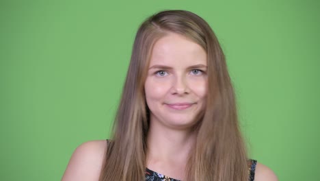 face of serious young pregnant woman nodding head no
