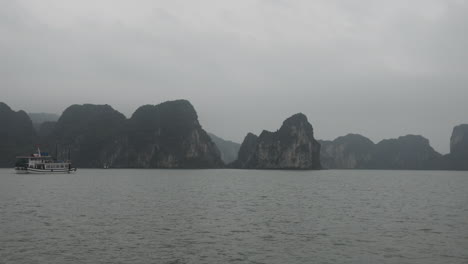 ha long bay, vietnam: foggy morning