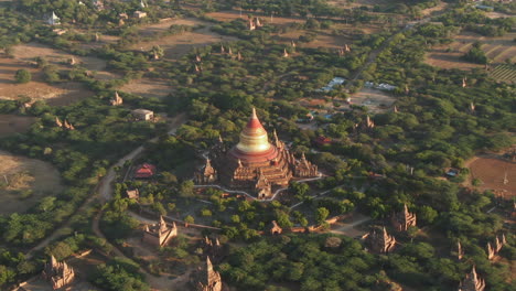 aerial top down shot of famous dhammayazika pagoda buddhist temple in bagan, myanmar at sunset