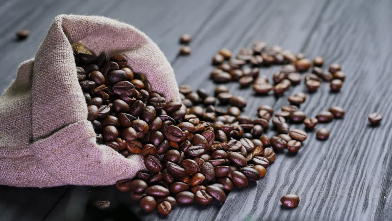 Coffee beans on the table. Coffee beans in sackcloth on table