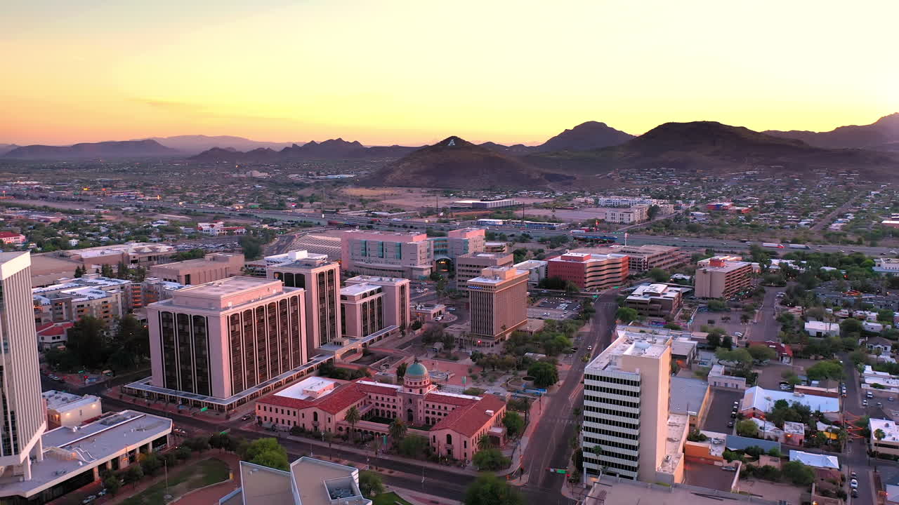 Tucson Arizona, aerial drone descending over Old Pima County Courthouse during vibrant sunset