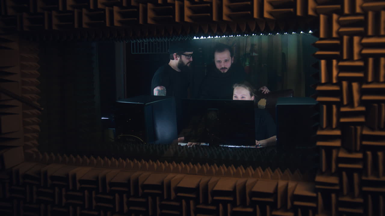 Group of Musicians Work in Sound Recording Studio