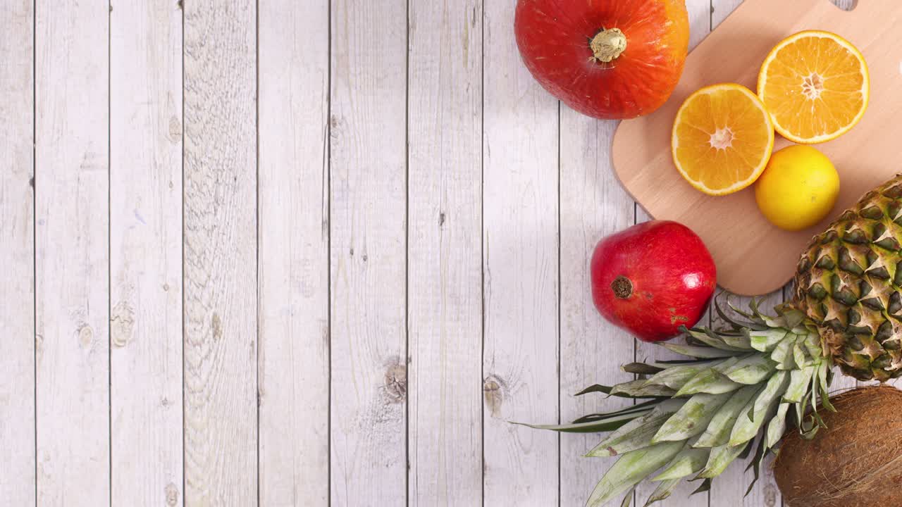 Empty frame for text appear next to tropic fruits. Stop motion