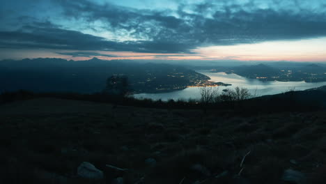 dramatic sunset over a serene lake and mountains